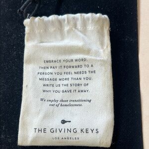 The Giving Keys Inspirational Cream Pouch and necklace
